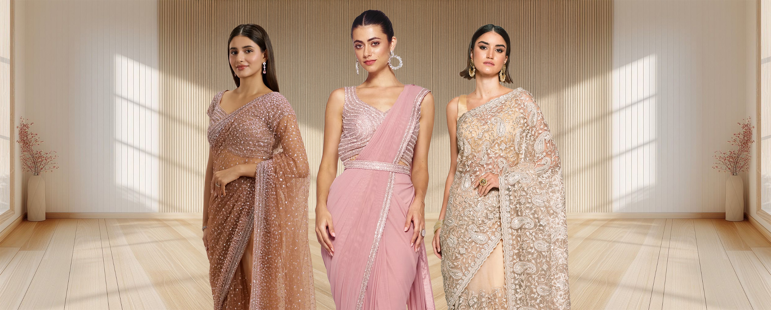 Three women showcasing different styles of traditional and contemporary pink silk sarees, illustrating the history of saree fashion.