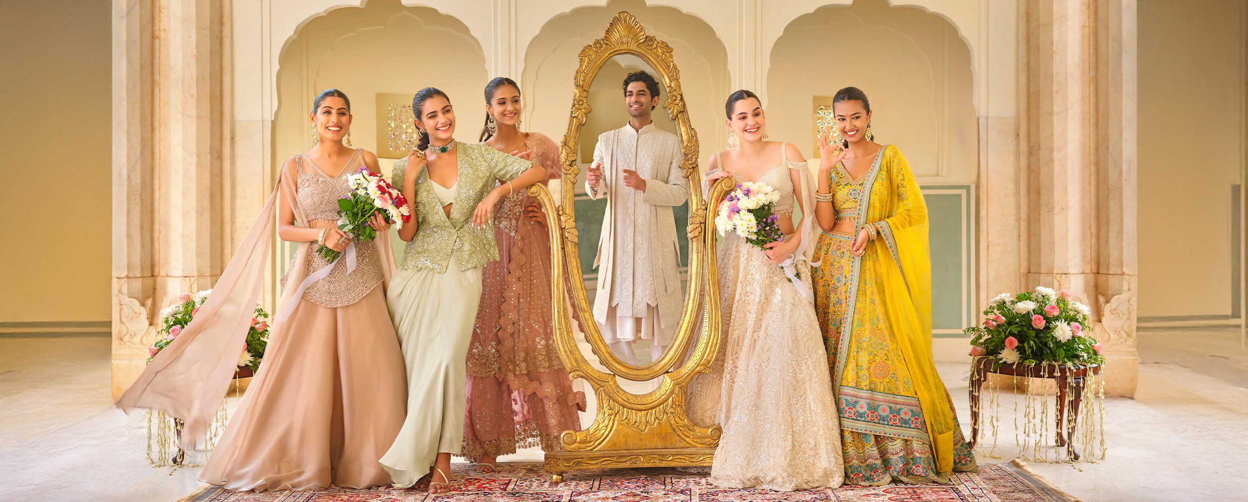 Womens iwearing colourfull sarees and lehengas for wedding ceremony Womens iwearing colourfull sarees and lehengas for wedding ceremony